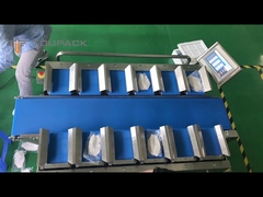 Frozen fish is weighed on a belt scale